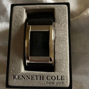 Kenneth Cole Men’s watch. Silver face and a black leather band